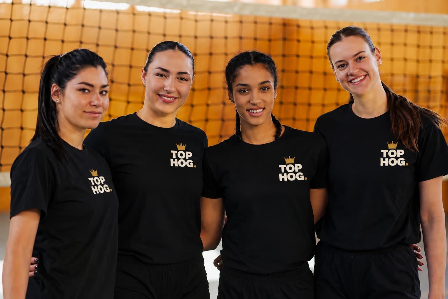 People in Top Hog branded T-shirts